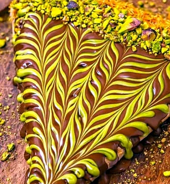 Close view of a Dubai chocolate crepe with pistachio swirl