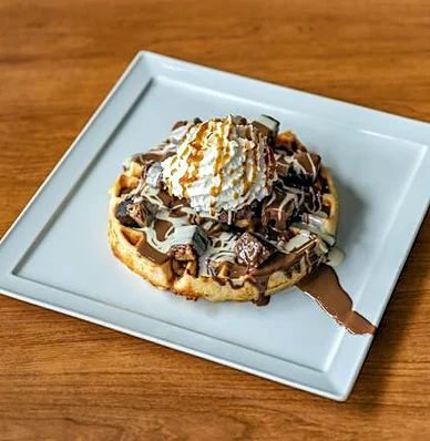 Pizza waffle, a dessert waffle with chocolate, caramel and cream